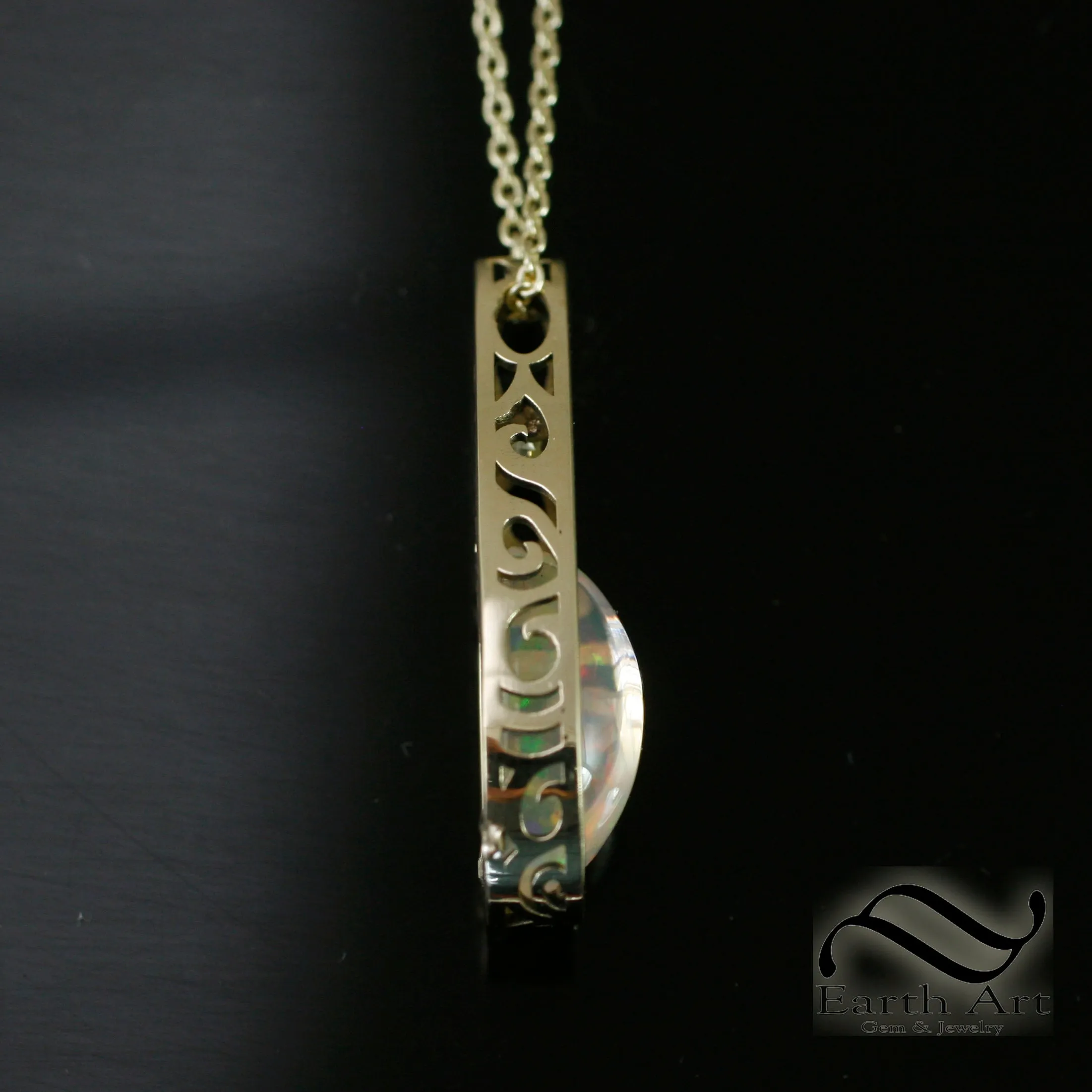 Art Deco Opal and Diamond pendant in 14k yellow gold