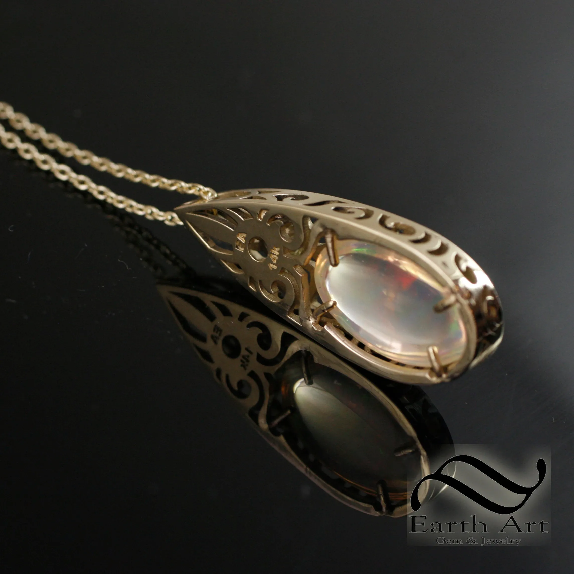Art Deco Opal and Diamond pendant in 14k yellow gold