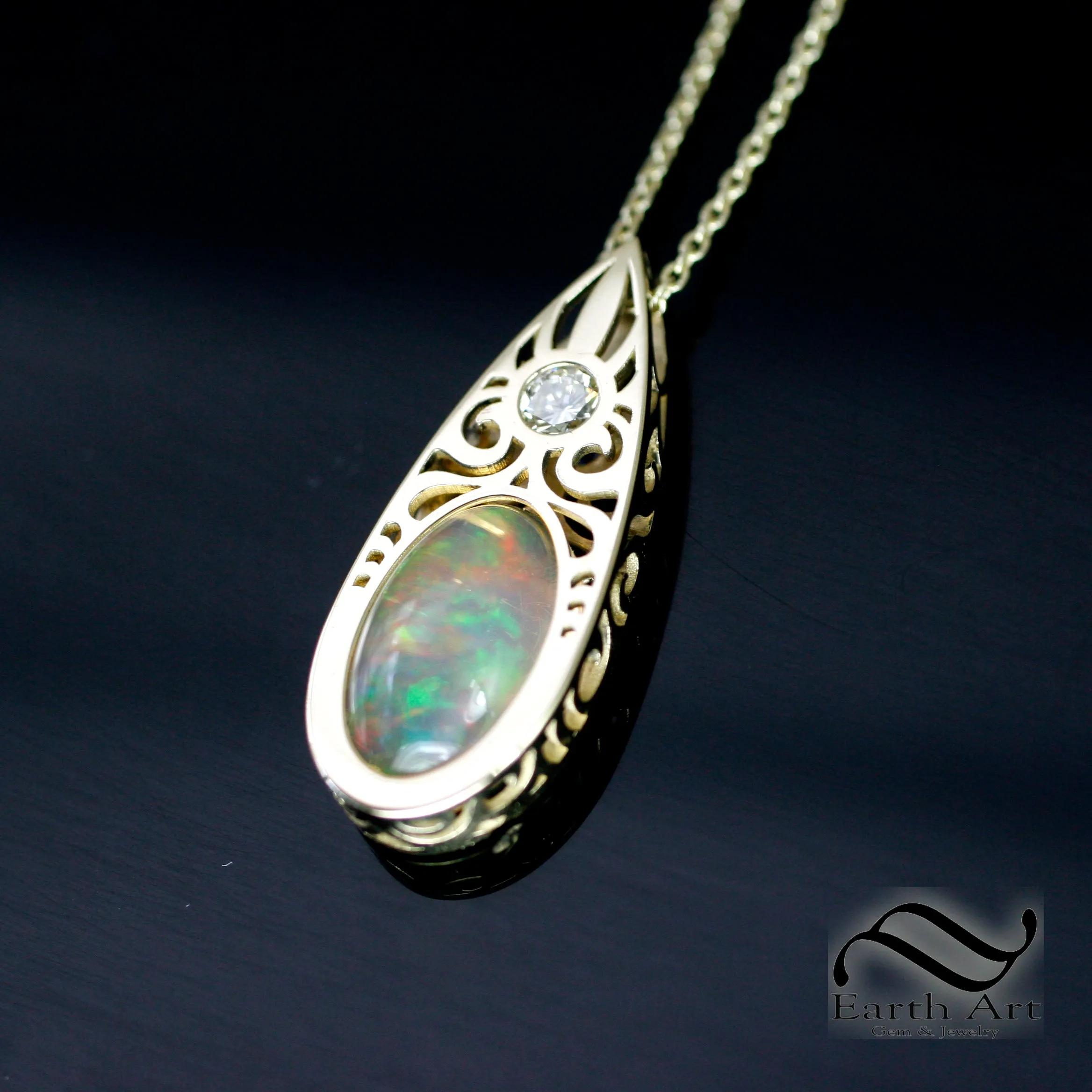 Art Deco Opal and Diamond pendant in 14k yellow gold