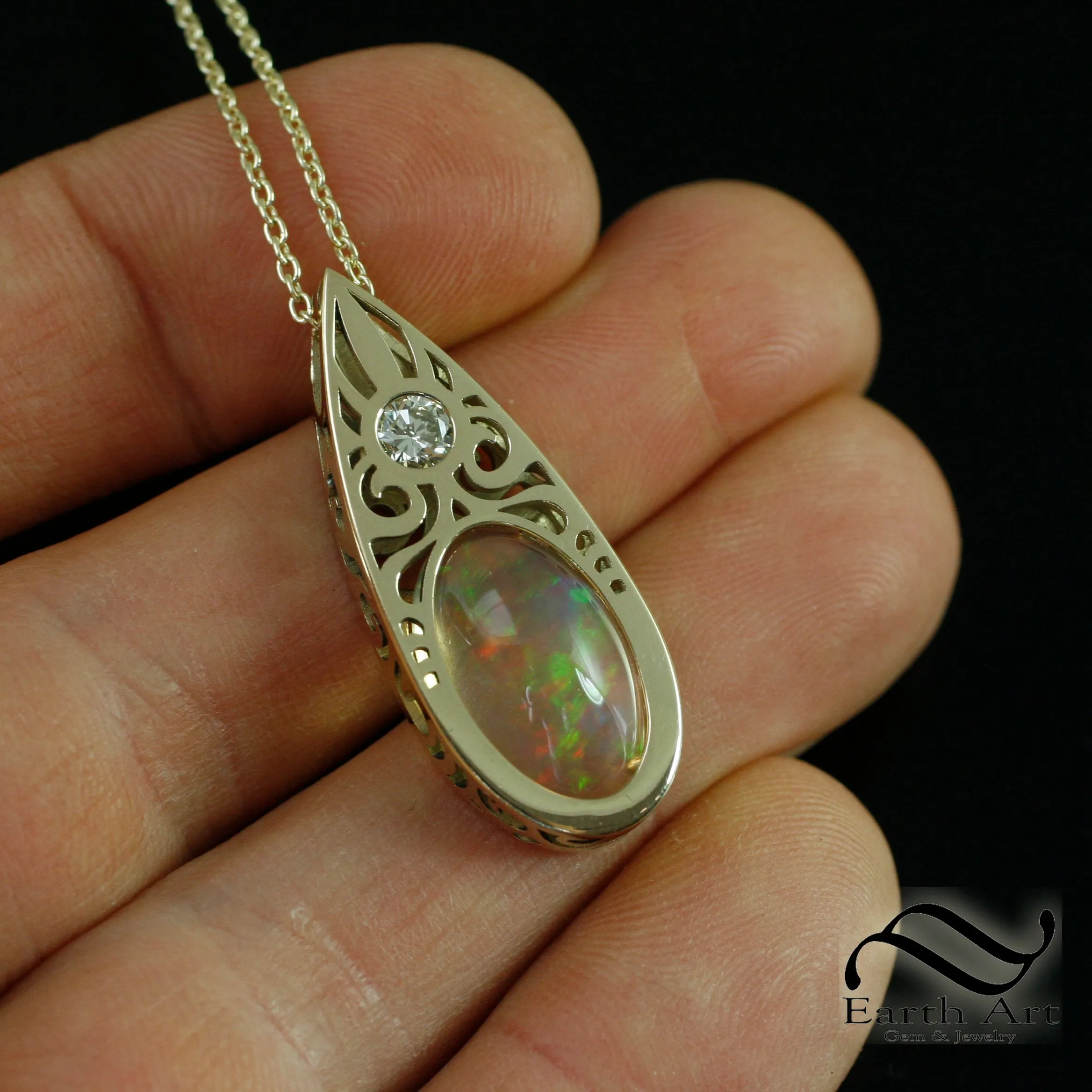 Art Deco Opal and Diamond pendant in 14k yellow gold