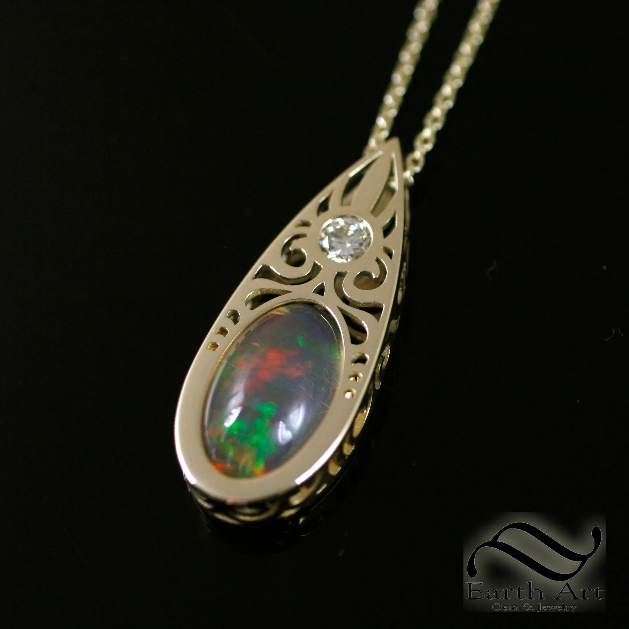 Art Deco Opal and Diamond pendant in 14k yellow gold