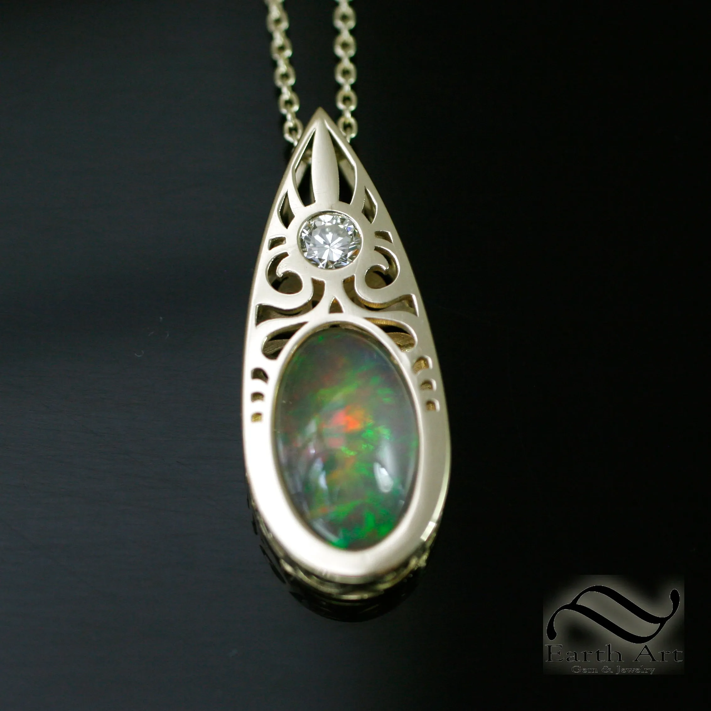 Art Deco Opal and Diamond pendant in 14k yellow gold