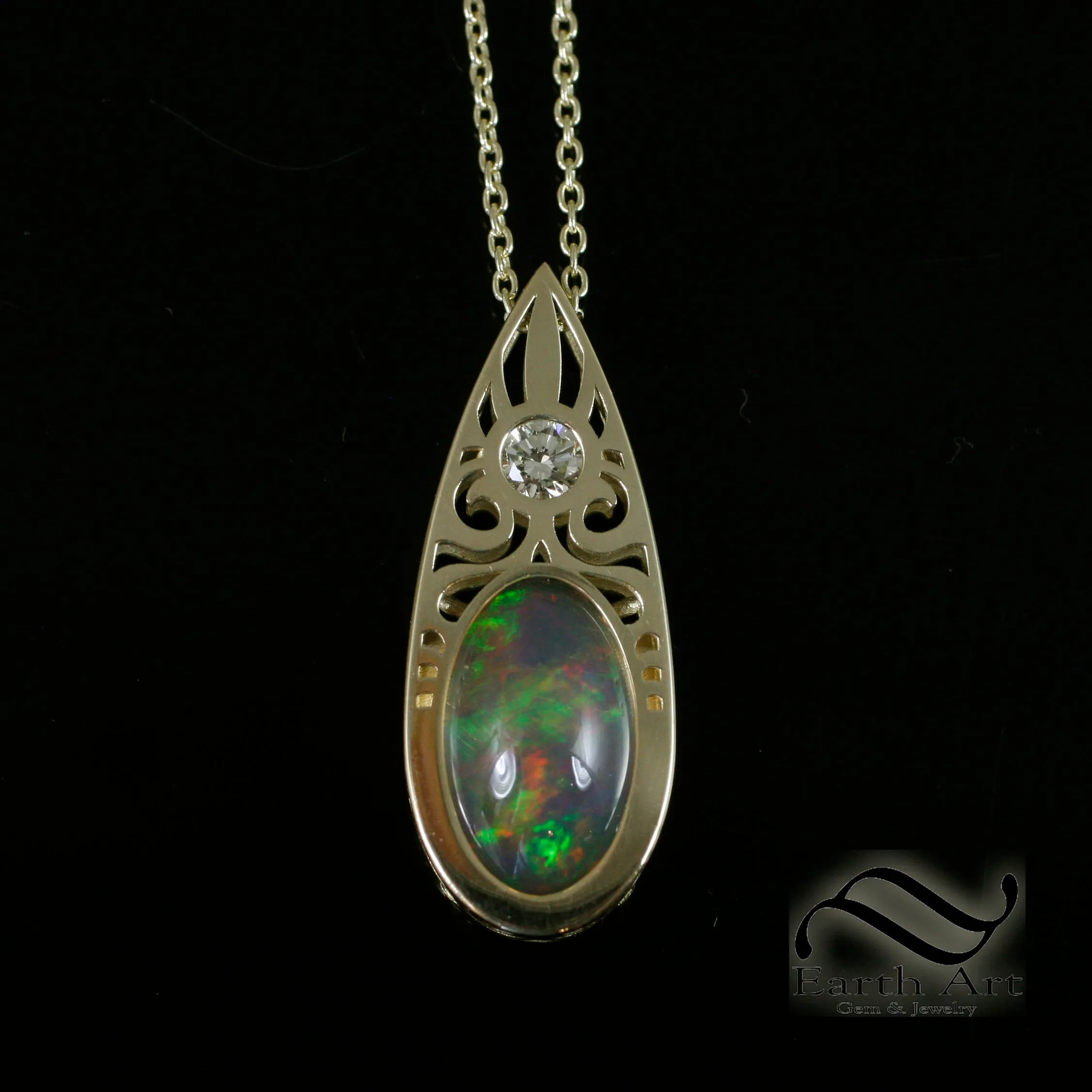 Art Deco Opal and Diamond pendant in 14k yellow gold