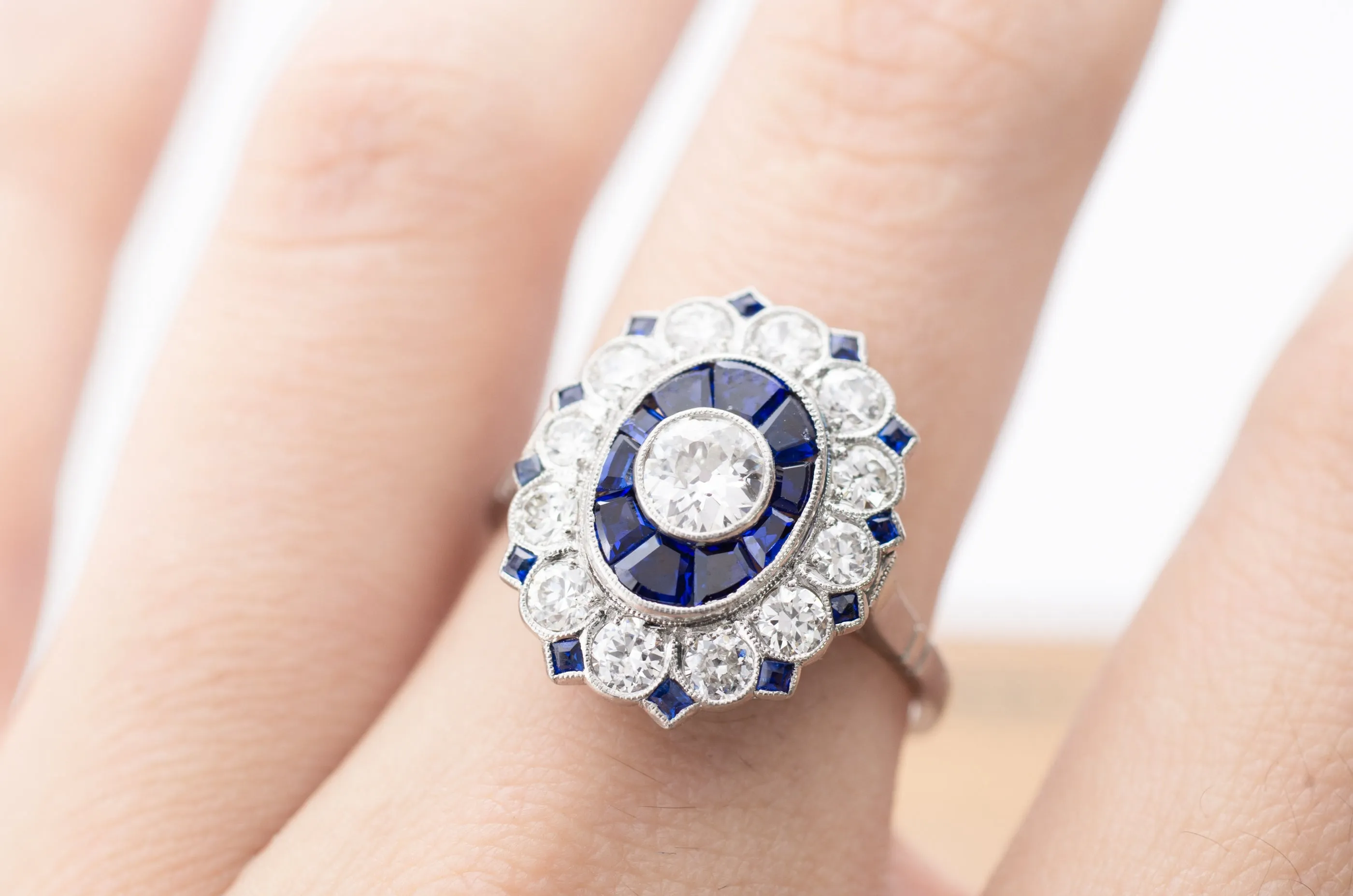 OLD EUROPEAN CUT DIAMOND AND SAPPHIRE TARGET RING.