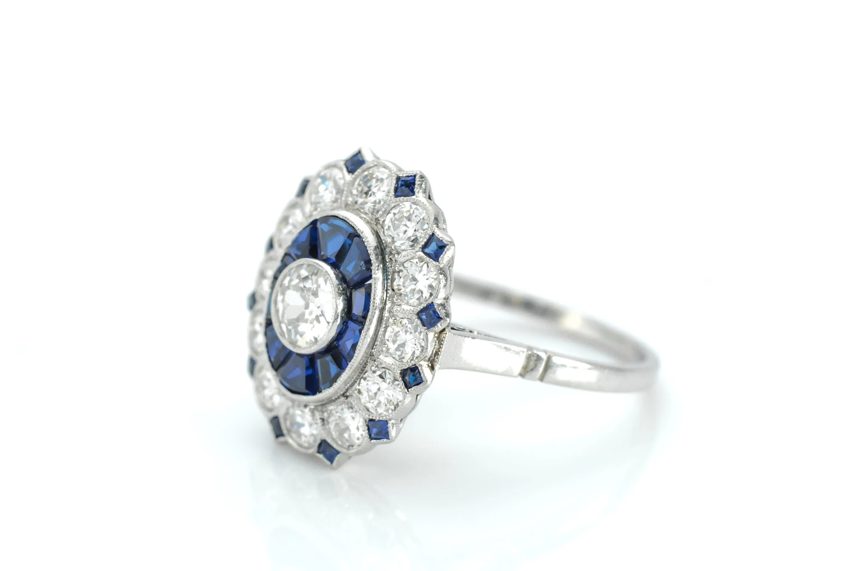 OLD EUROPEAN CUT DIAMOND AND SAPPHIRE TARGET RING.