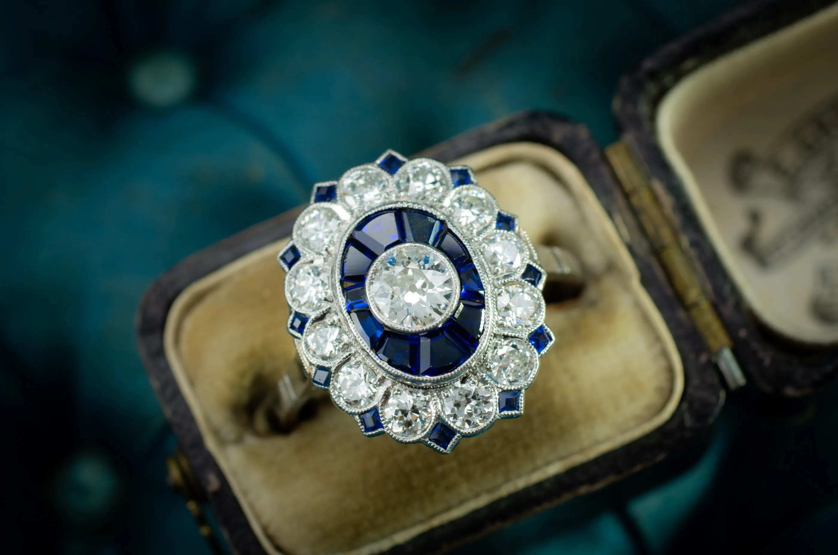 OLD EUROPEAN CUT DIAMOND AND SAPPHIRE TARGET RING.