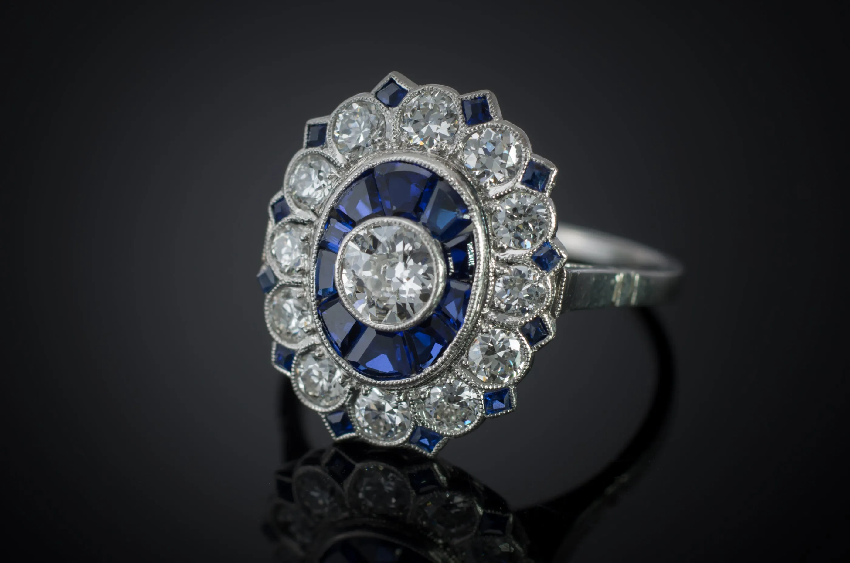 OLD EUROPEAN CUT DIAMOND AND SAPPHIRE TARGET RING.