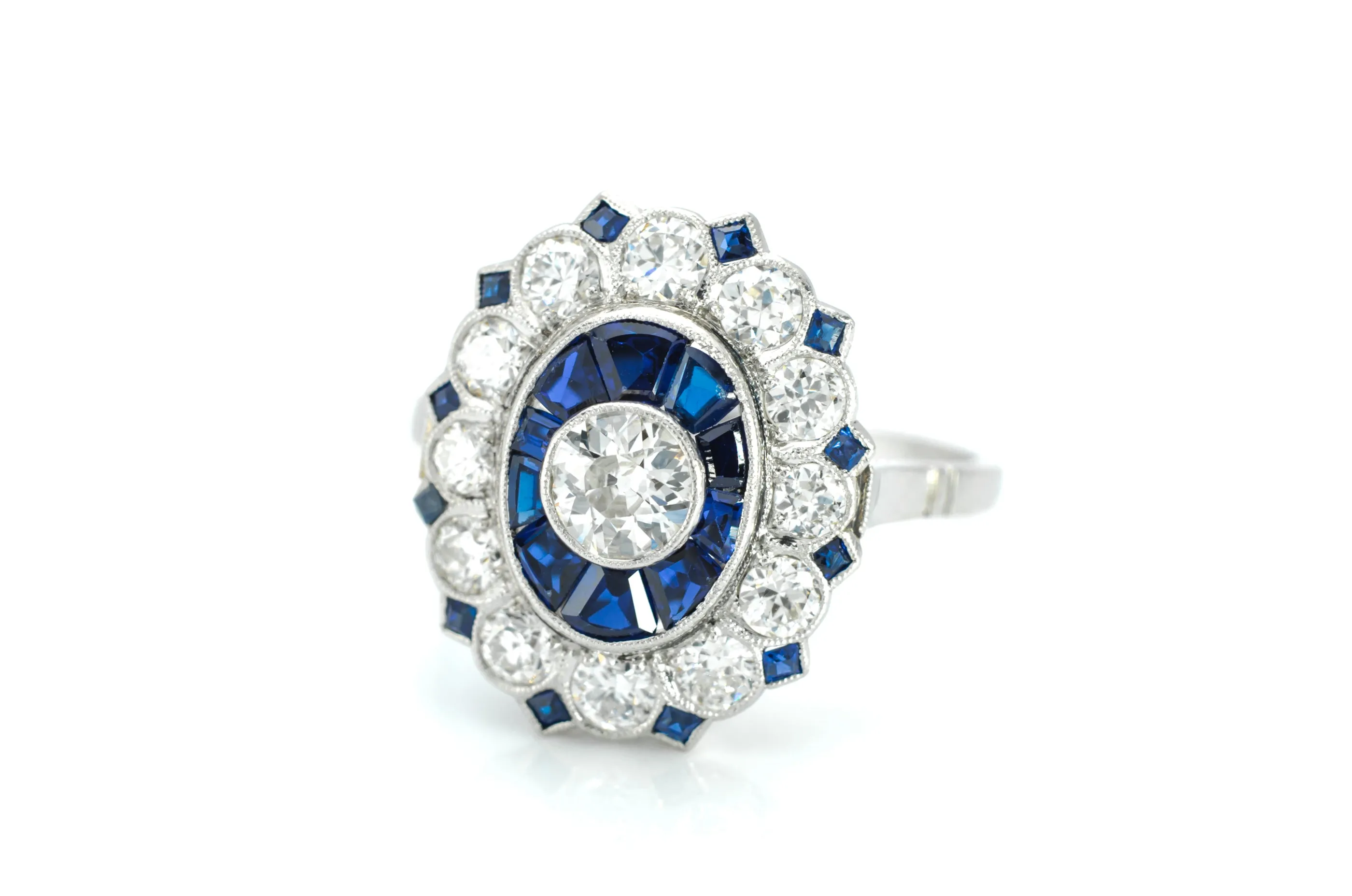 OLD EUROPEAN CUT DIAMOND AND SAPPHIRE TARGET RING.