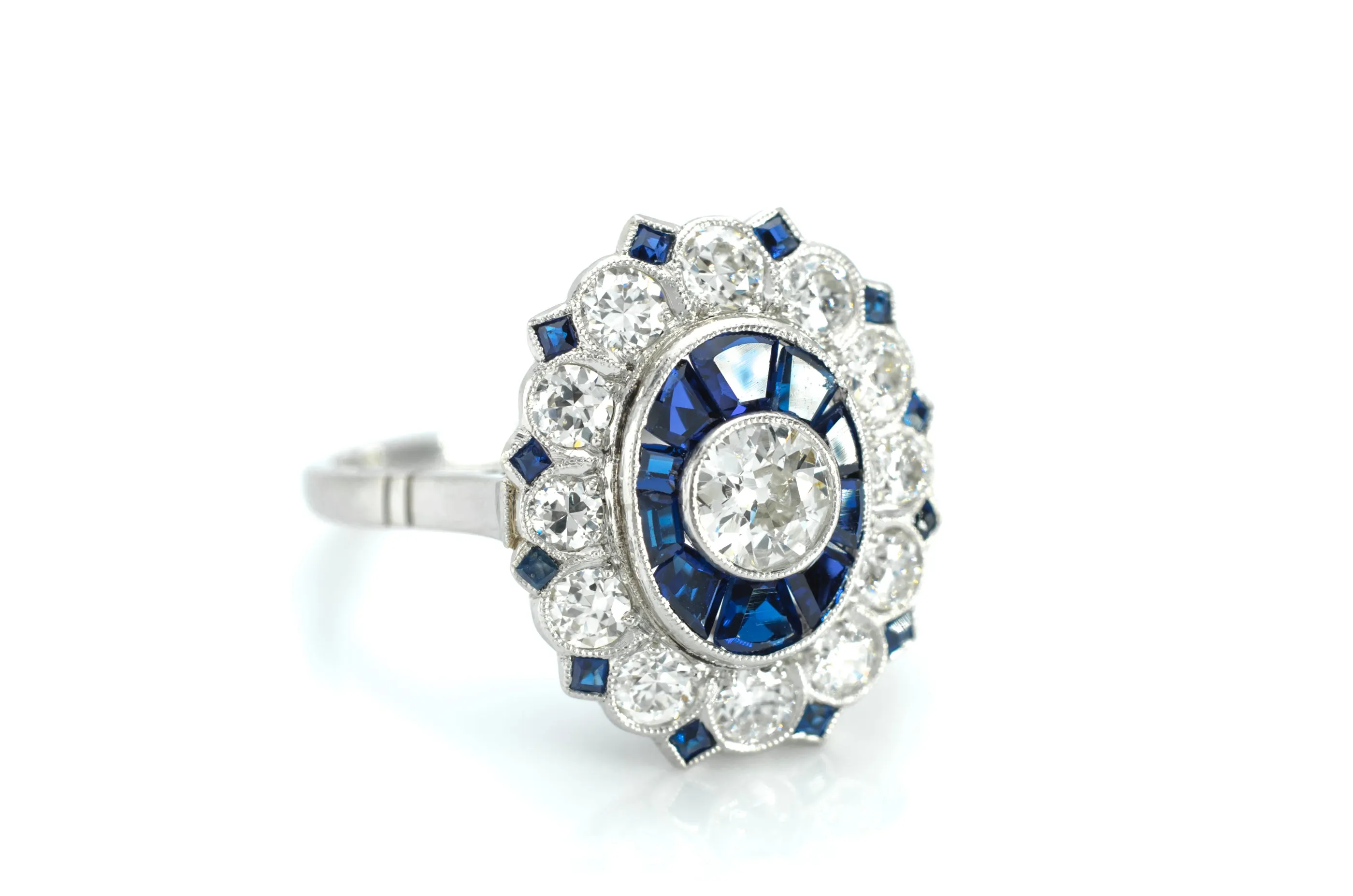 OLD EUROPEAN CUT DIAMOND AND SAPPHIRE TARGET RING.
