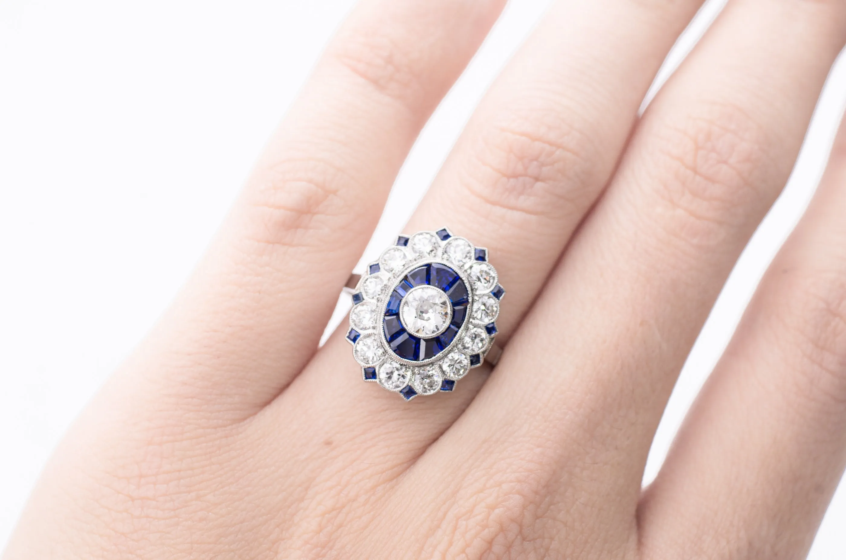 OLD EUROPEAN CUT DIAMOND AND SAPPHIRE TARGET RING.