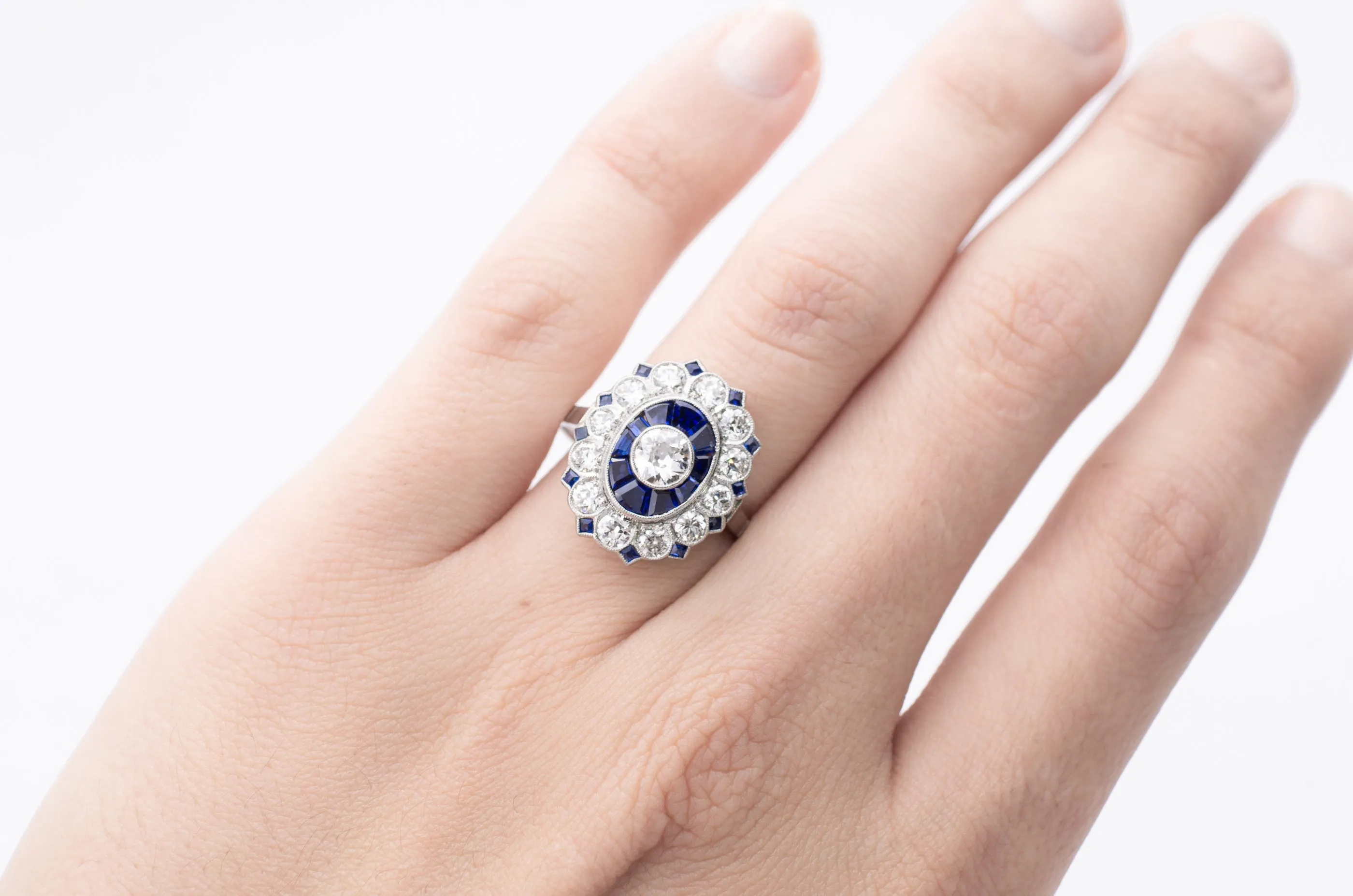 OLD EUROPEAN CUT DIAMOND AND SAPPHIRE TARGET RING.