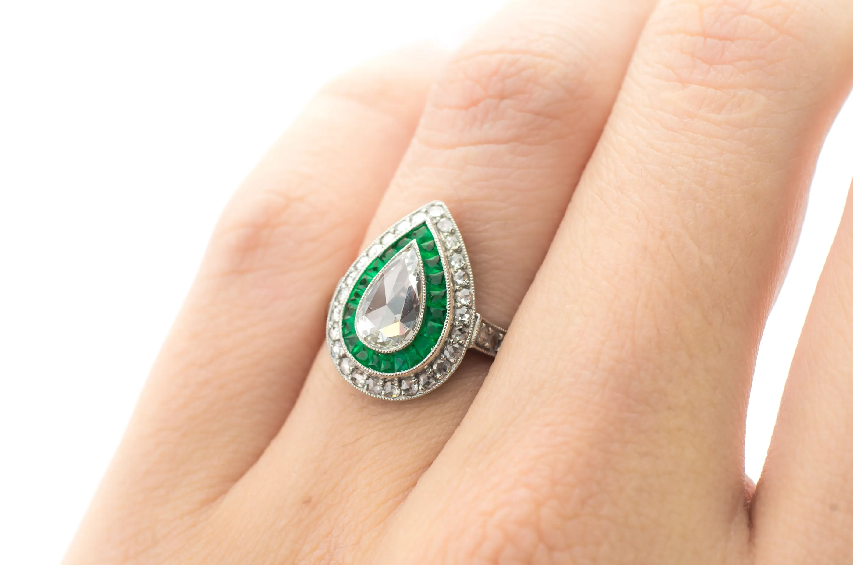 PEAR ROSE CUT DIAMOND AND FRENCH CUT EMERALD RING