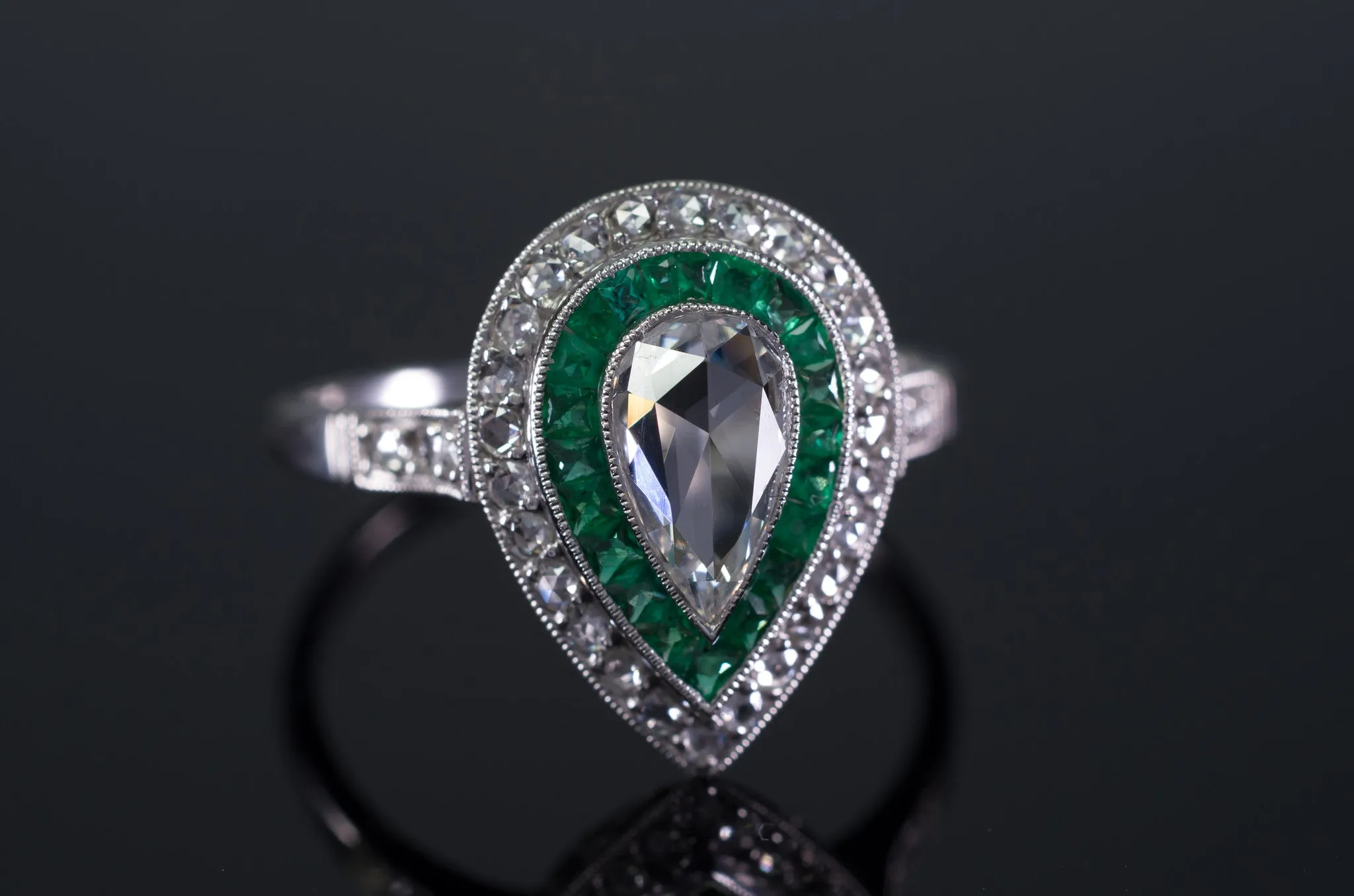 PEAR ROSE CUT DIAMOND AND FRENCH CUT EMERALD RING