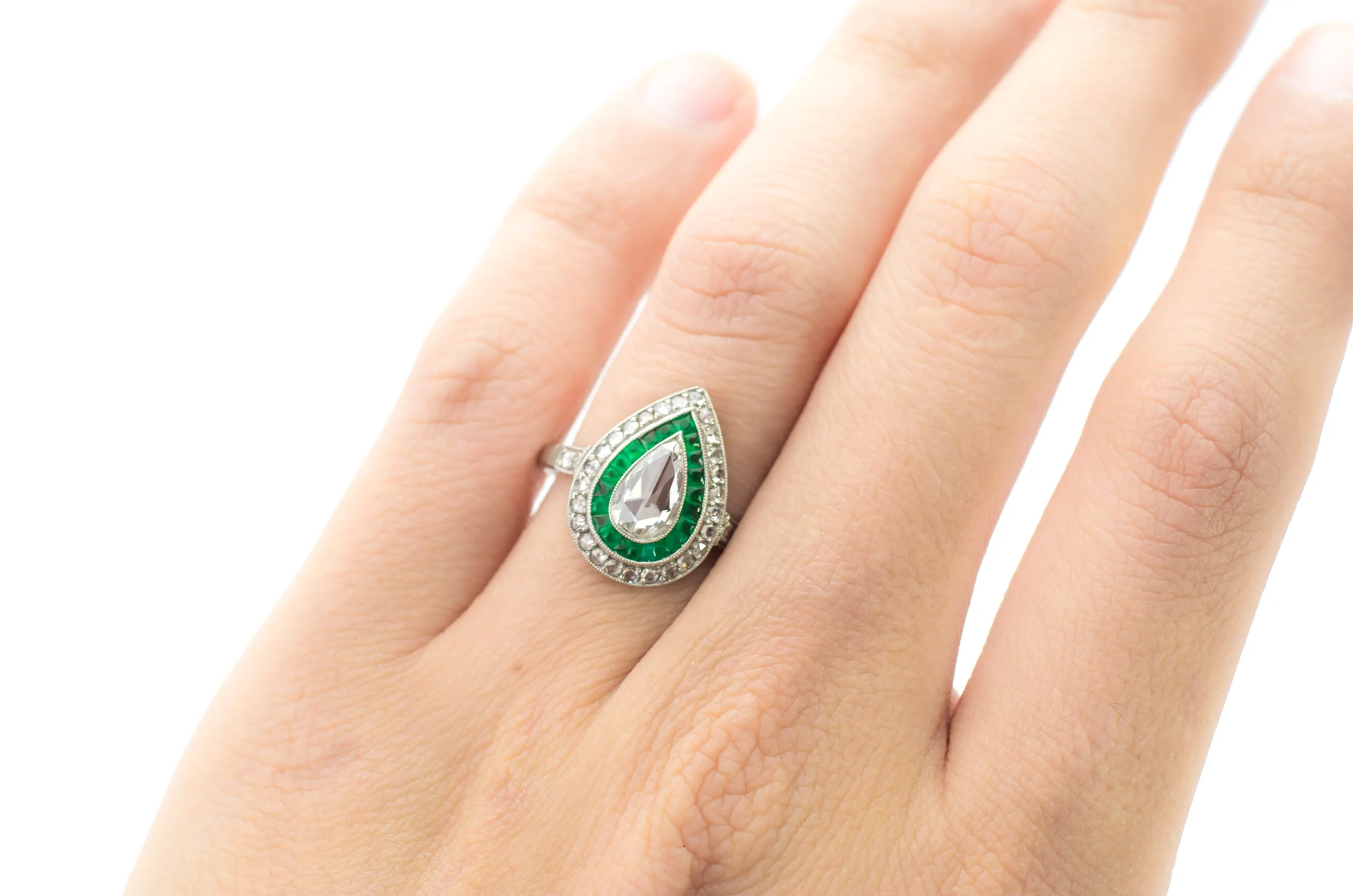PEAR ROSE CUT DIAMOND AND FRENCH CUT EMERALD RING