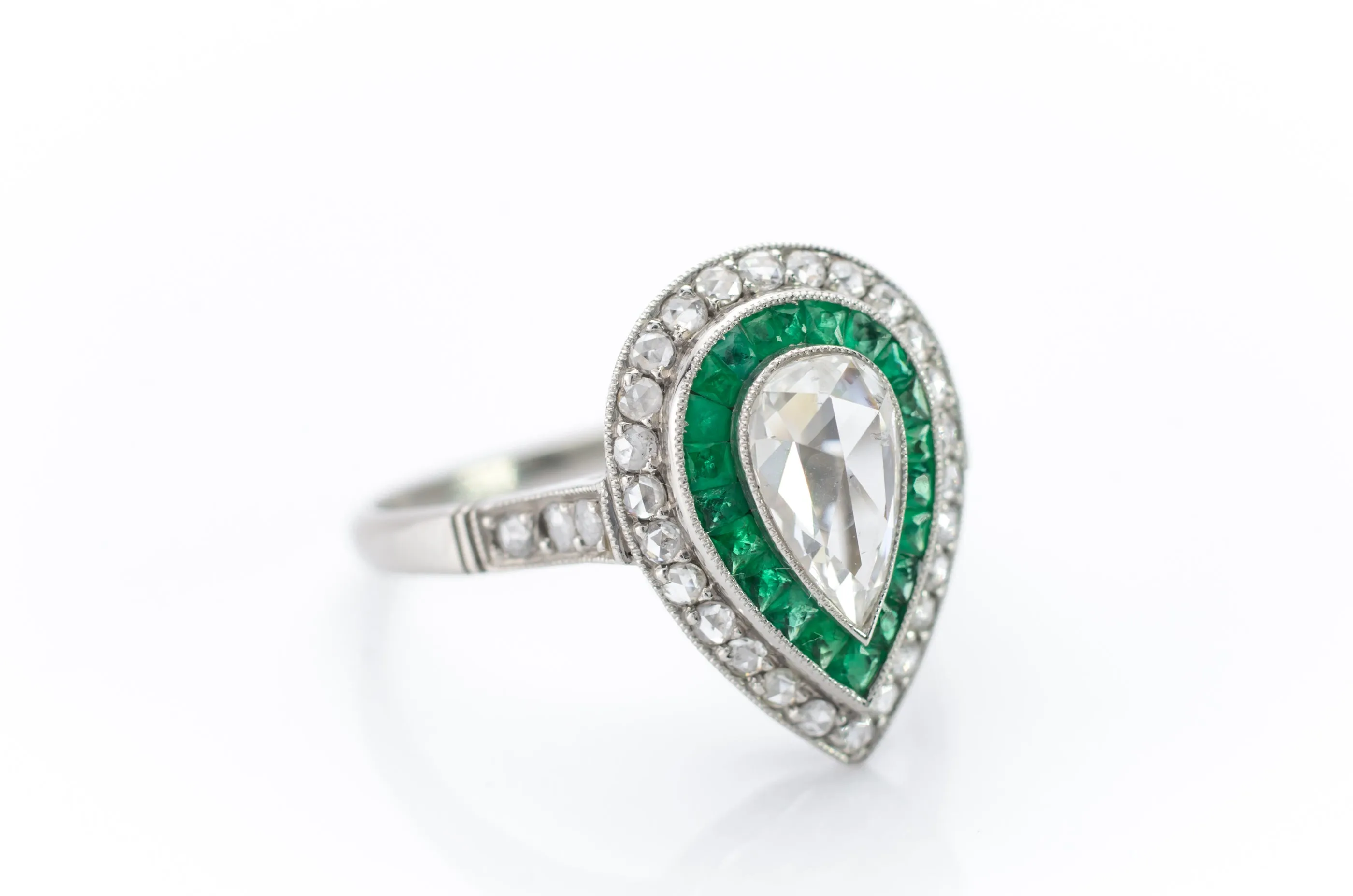 PEAR ROSE CUT DIAMOND AND FRENCH CUT EMERALD RING