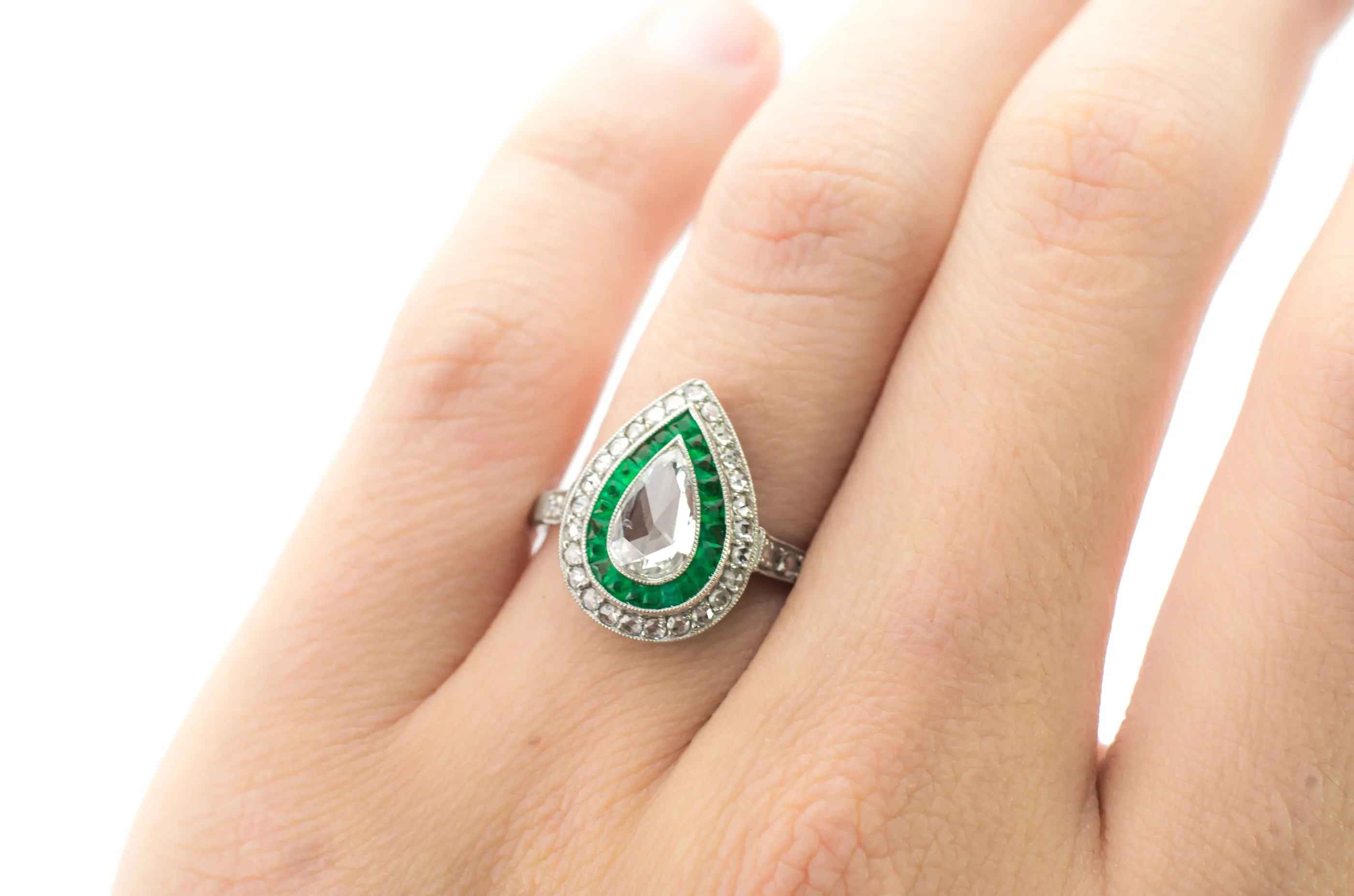 PEAR ROSE CUT DIAMOND AND FRENCH CUT EMERALD RING