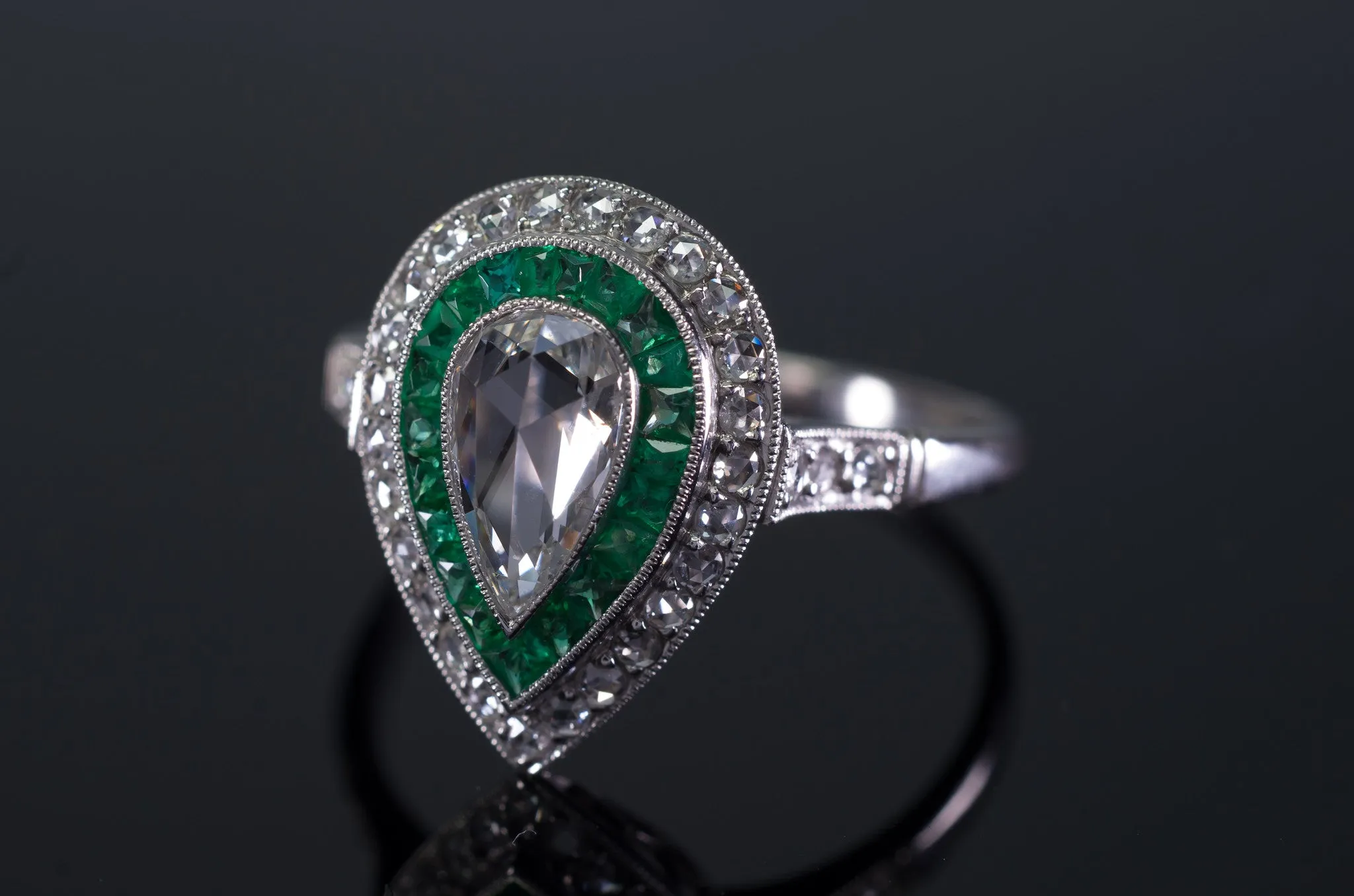 PEAR ROSE CUT DIAMOND AND FRENCH CUT EMERALD RING
