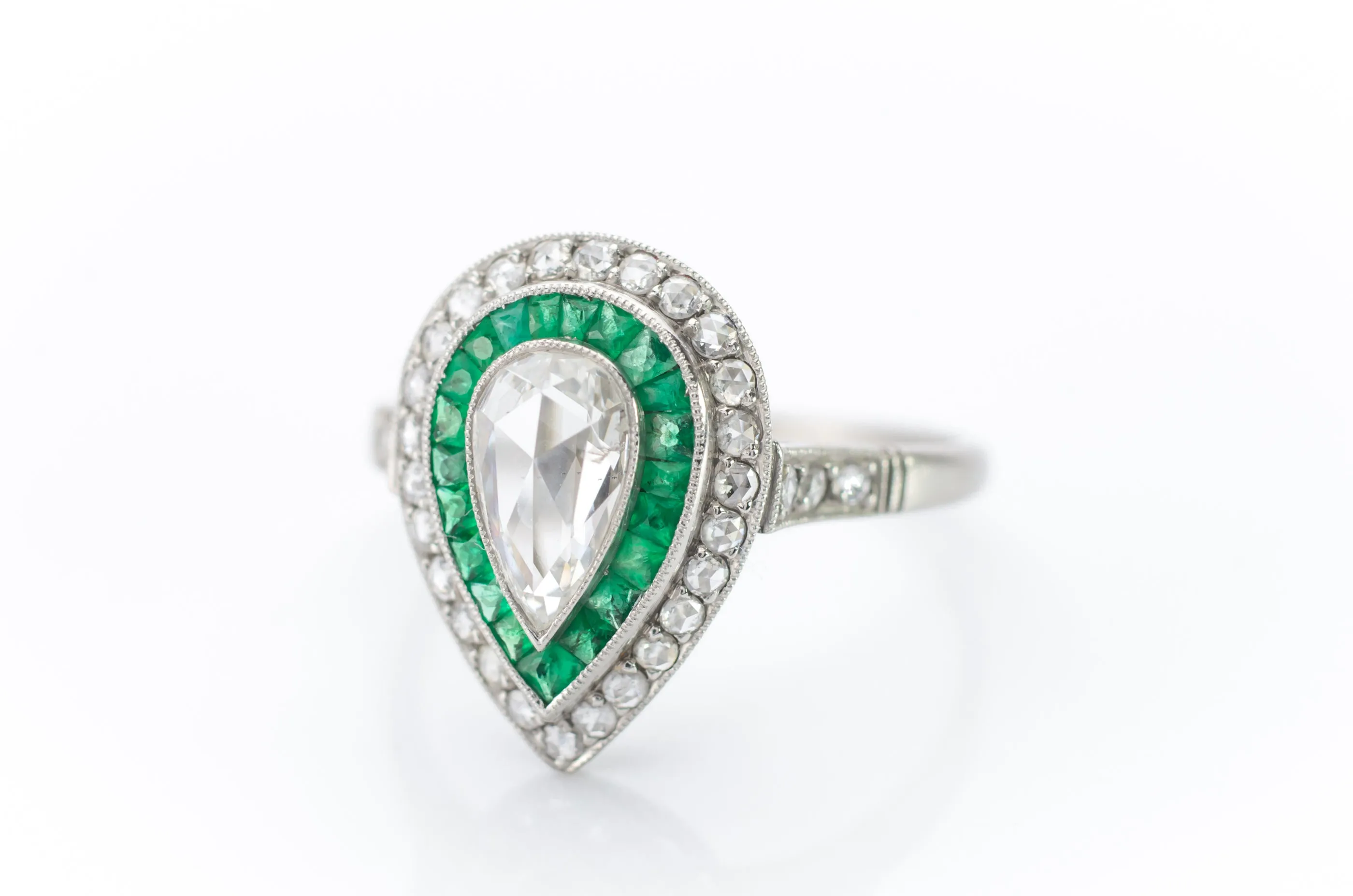 PEAR ROSE CUT DIAMOND AND FRENCH CUT EMERALD RING