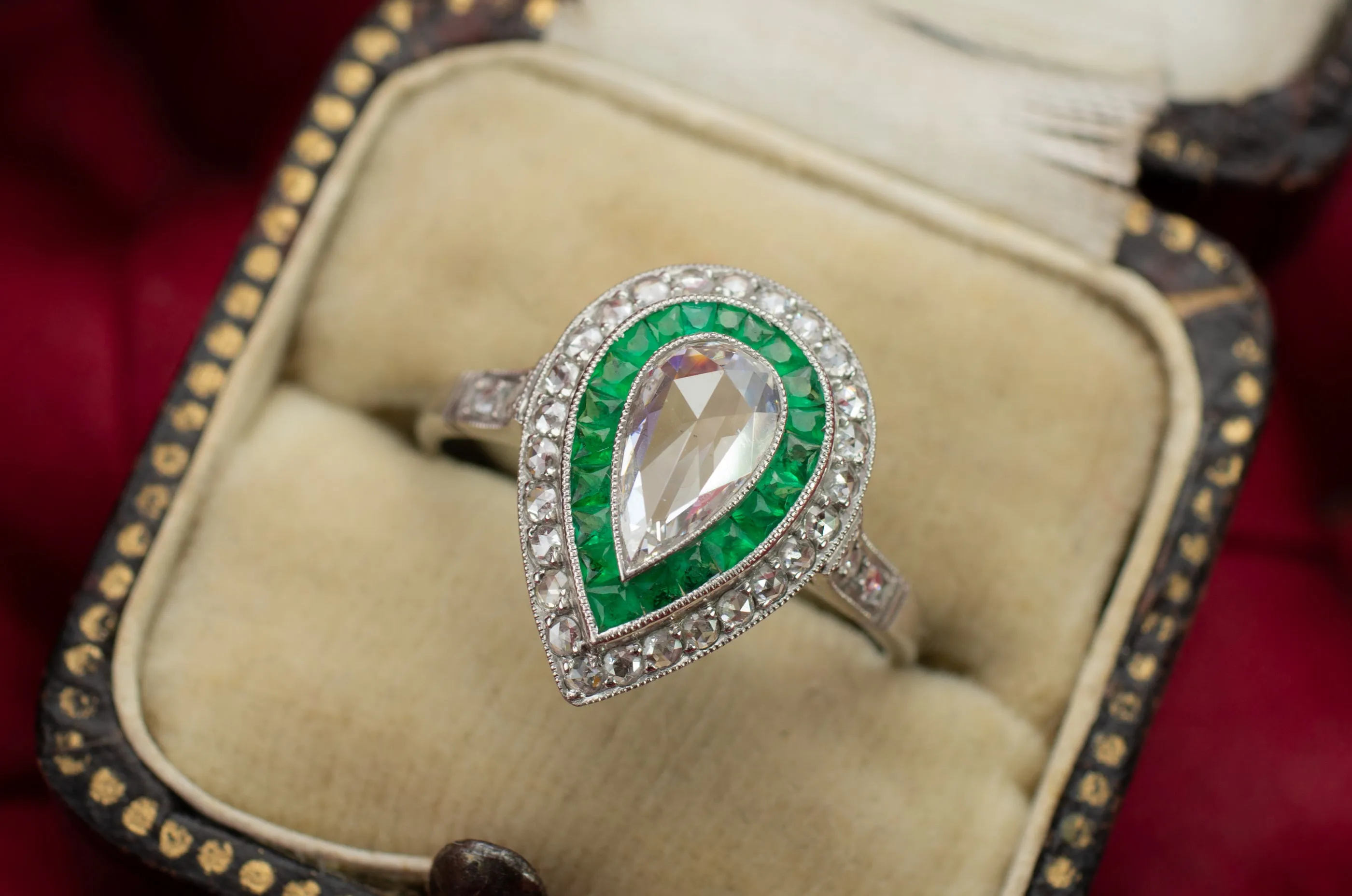 PEAR ROSE CUT DIAMOND AND FRENCH CUT EMERALD RING